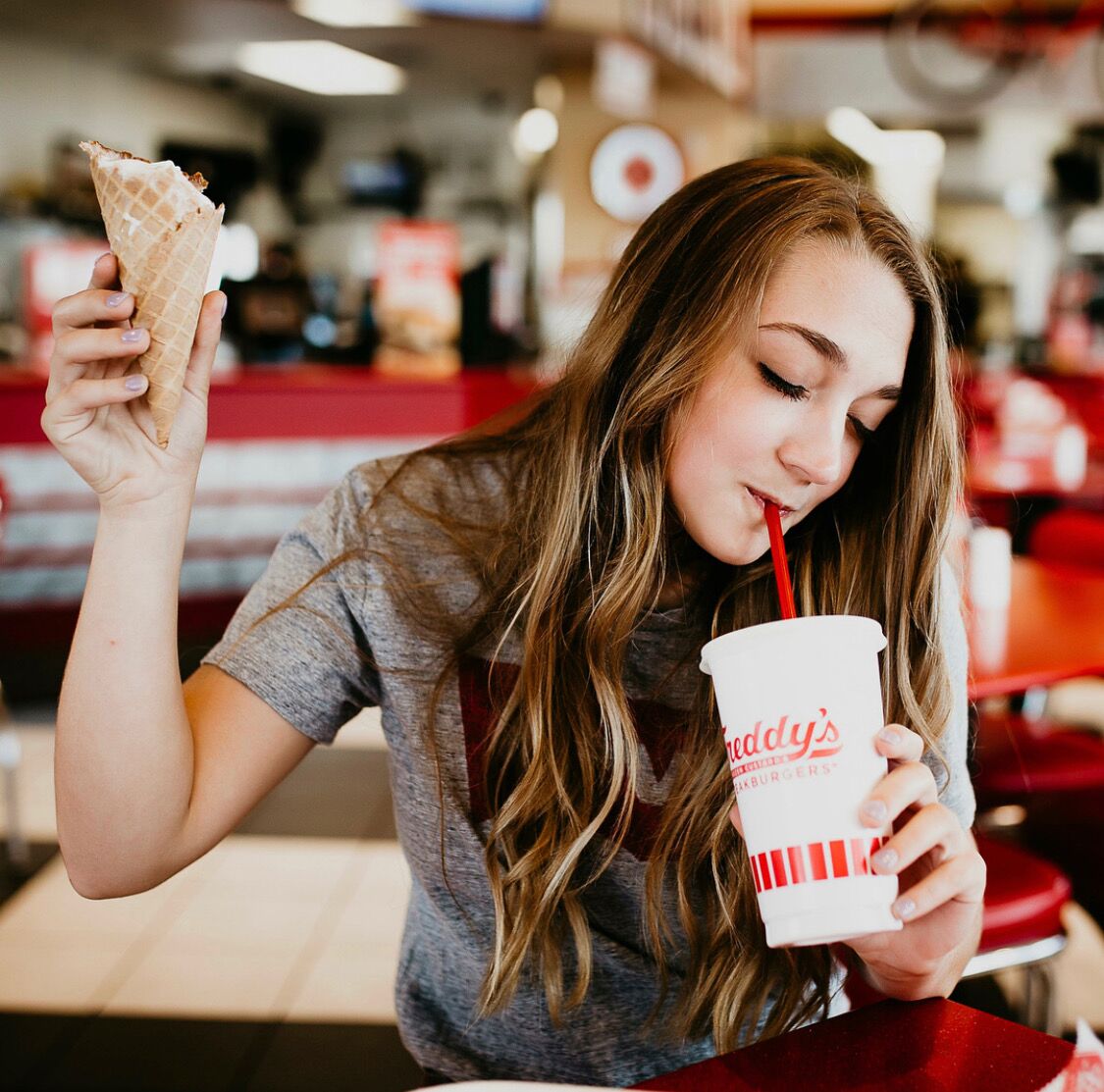 Girl eating Freddy's