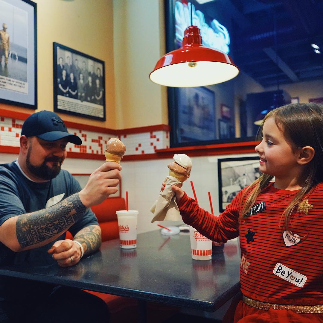 Two people enjoying custard cones